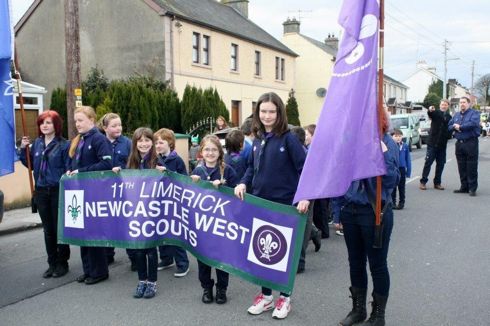 Cub Scouts holding our banner for the parade